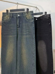 Men's plus-size vintage wash wide-leg jeans in medium blue and black denim.