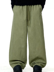 Army green relaxed wide-leg drawstring trousers with pockets and a comfortable fit.