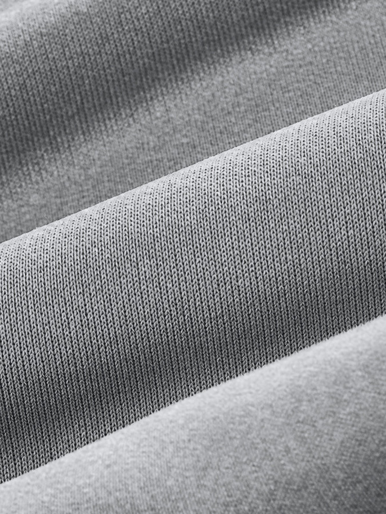 Light gray men's sweatpants with textured knit fabric detail.