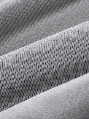 Light gray men's sweatpants with textured knit fabric detail.