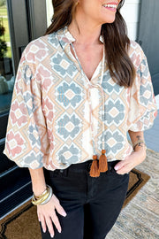 Geometric print blouse with tassel tie in floral, featuring a relaxed fit and tie neckline.