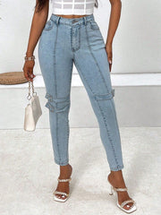 Light wash denim jeans with buckle detail and seam accents.