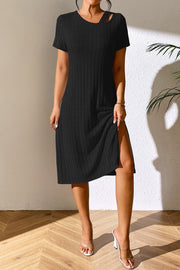 Black ribbed midi dress with short sleeves, asymmetrical neckline detail and high slit.