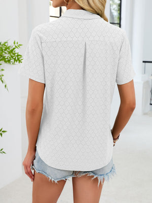 White eyelet polo collar blouse with short sleeves and a back pleat detail.