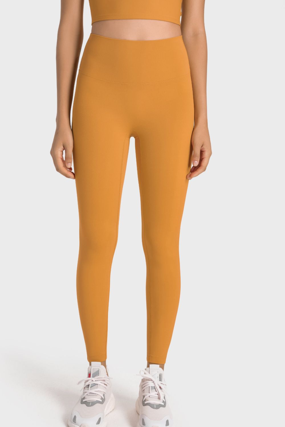 Yellow seamless high-waist performance leggings with a sculpted fit.