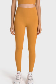 Yellow seamless high-waist performance leggings with a sculpted fit.
