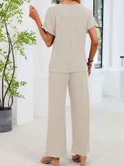 Beige waffle knit two-piece set with short sleeves and wide-leg pants.