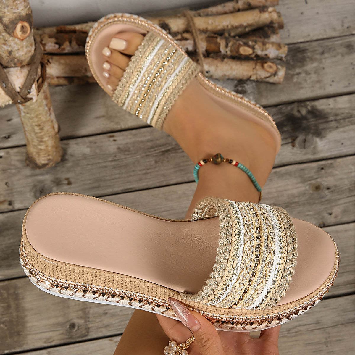 Embellished open-toe platform sandals with woven straps and beaded trim.