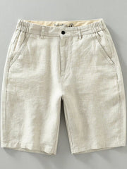 Beige lightweight chino shorts with elastic waistband and pockets.