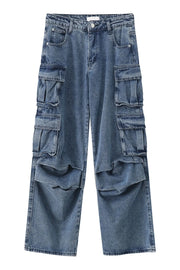 Baggy denim cargo pants in medium wash with multiple pleated pockets.