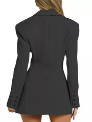 Black tailored lapel blazer dress with buttoned cuffs and structured shoulders.