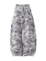 Baggy white camouflage cargo pants with button fly and multiple pockets.