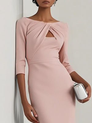 Blush pink midi dress with twist-front and cutout detail, 3/4 sleeves.