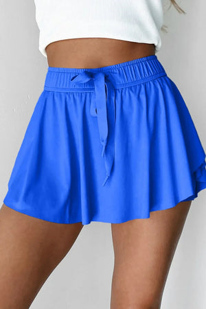 Blue flared skort with tie waist and elastic waistband