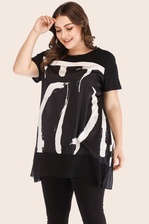 Black tunic with white brushstroke overlay and black leggings.