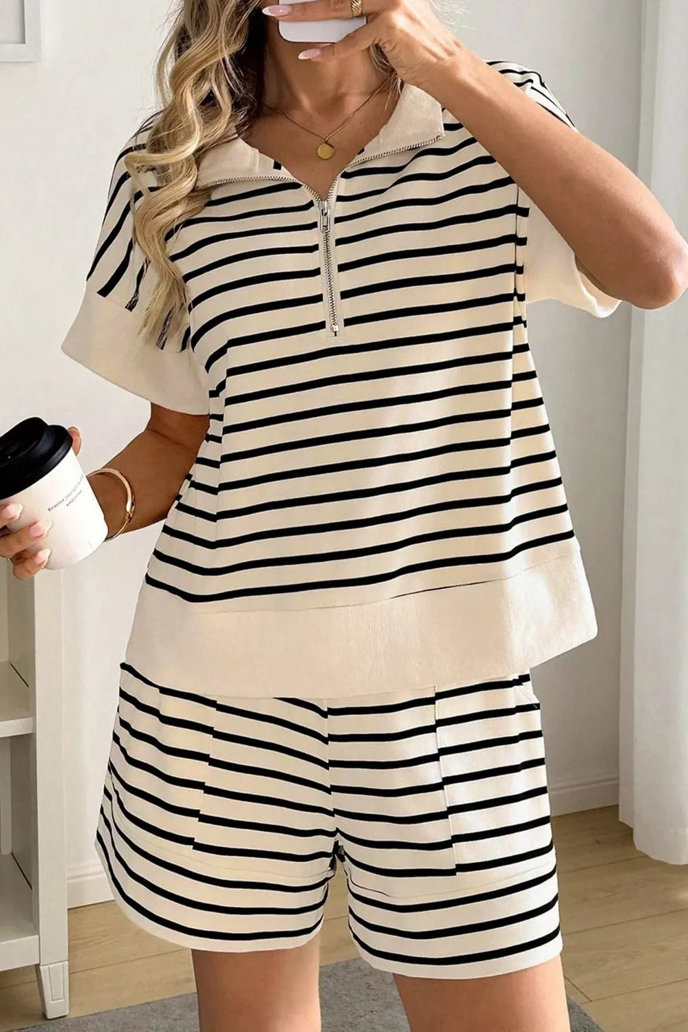 Classic striped half-zip top and shorts set in beige and black cotton.