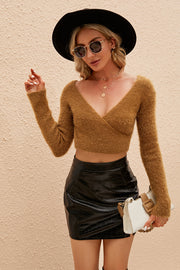 Plush wrap crop sweater in camel with long sleeves and a deep V-neck.