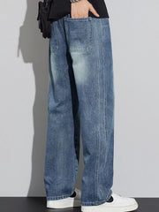 Men's blue wide-leg jeans with drawstring detail and visible stitching.
