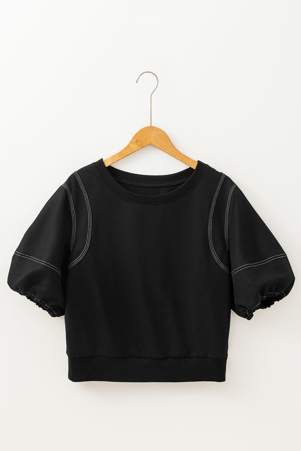 Black puff sleeve blouse with contrast stitching and crew neck.