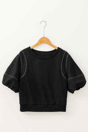 Black puff sleeve blouse with contrast stitching and crew neck.