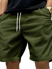 Army green corduroy drawstring shorts with a relaxed fit and white drawstrings.