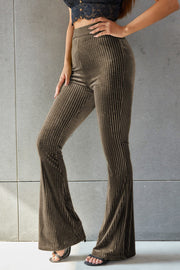 Ribbed velvet palazzo trousers in brown with a high waist and flared leg.