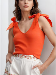 Orange ribbed knit tank top with bow shoulder straps and V-neck
