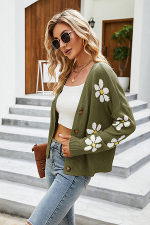 Moss green knit cardigan with white daisy print, button front, and V-neck.