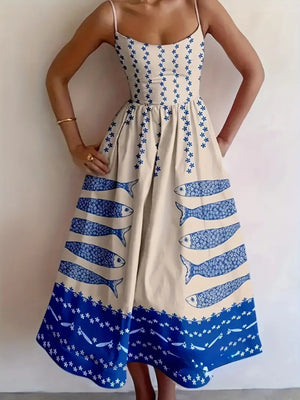 Spaghetti strap midi dress in cream with blue sardine and floral print.
