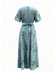 Teal floral maxi dress with short sleeves, defined waist tie, and back zipper.