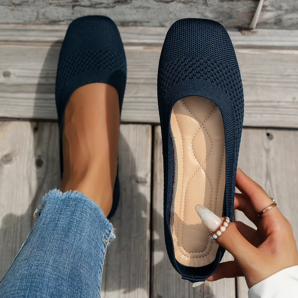 Dark blue breathable knit square-toe flats with cushioned insole.