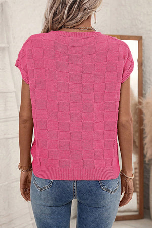 Pink checkered knit tee with short sleeves and crew neck, made of acrylic.
