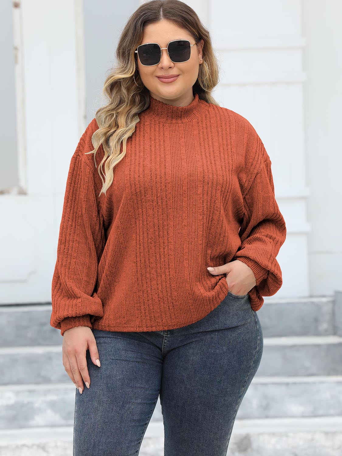 Textured mock neck sweater in Ochre with balloon sleeves and ribbed knit detail.