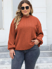Textured mock neck sweater in Ochre with balloon sleeves and ribbed knit detail.