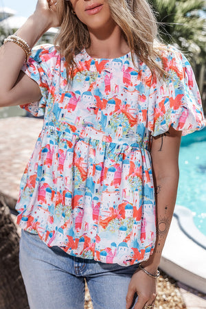 Multicolor peplum blouse with watercolor village print, short puff sleeves, and tiered bodice.