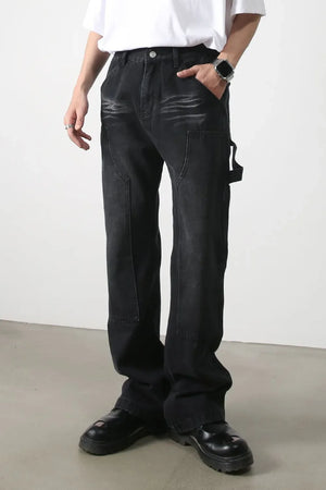 Dark wash denim wide leg carpenter jeans with utility loop and pocket details.