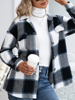 Belted black plaid overshirt with patch pockets and button-down front.