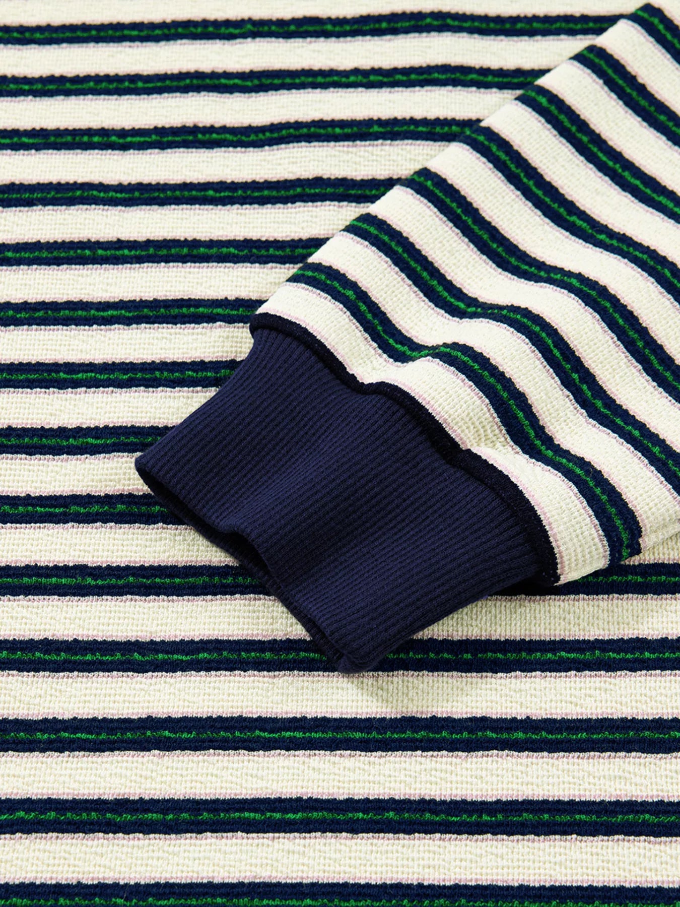 Striped top in navy with contrast collar detail and ribbed cuffs.
