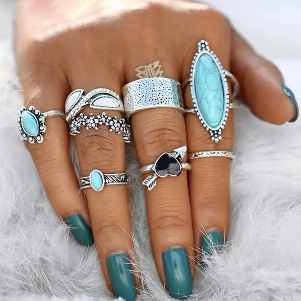 Bohemian silver ring set with assorted turquoise stones and designs.