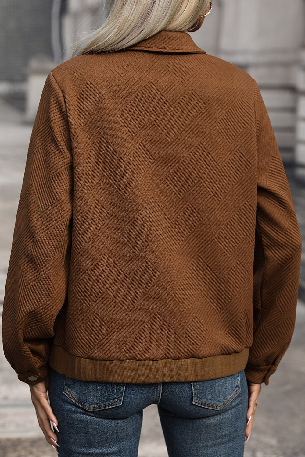 Textured chevron utility jacket in burnt umber with a zip front and collared neckline.