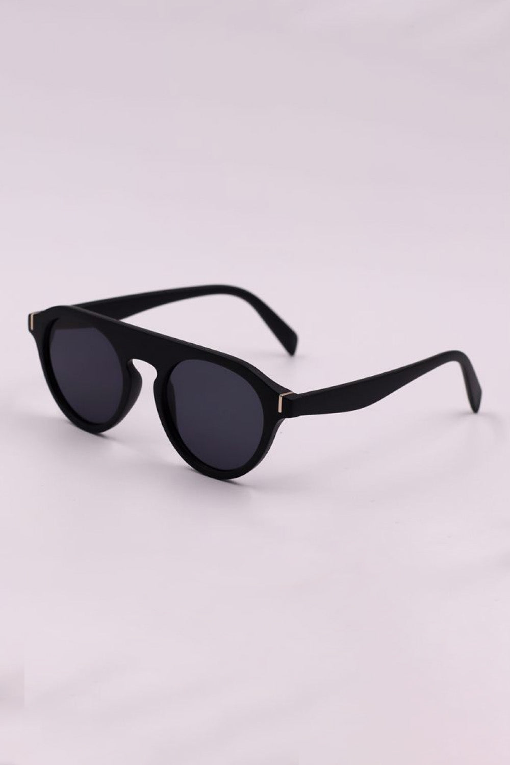 Black round frame sunglasses with dark lenses and gold accents