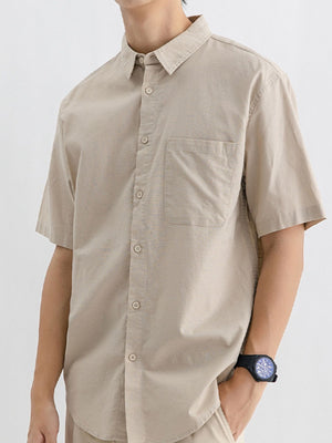 Men's Khakis short sleeve cotton button-up shirt with chest pocket.