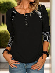 Black raglan henley tee with striped sleeves and button detail