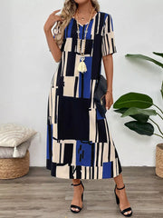 Midi dress with geometric print, V-neck, short sleeves, and a flowy skirt.