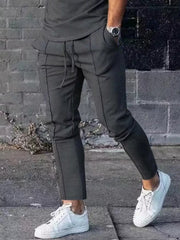 Dark gray casual drawstring sweatpants with pockets and contrast stitching.
