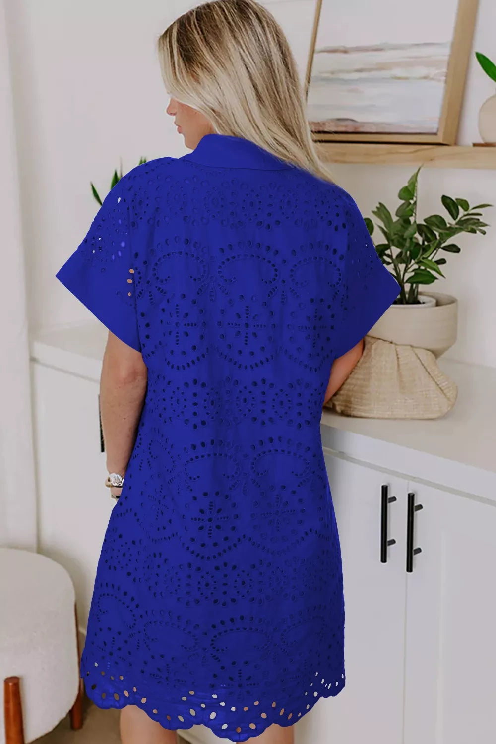 Blue cotton mini dress with allover eyelet embroidery and scalloped hem.