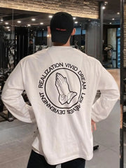 White long sleeve t-shirt with praying hands graphic and text on back