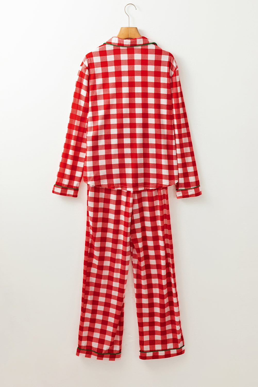 Red and white gingham pajama set with green trim, collared long sleeve top and pants.