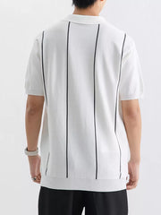 White knit polo shirt with vertical black stripes and ribbed hem.