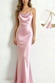 Blush pink satin cowl neck maxi dress with pearl-embellished spaghetti straps.